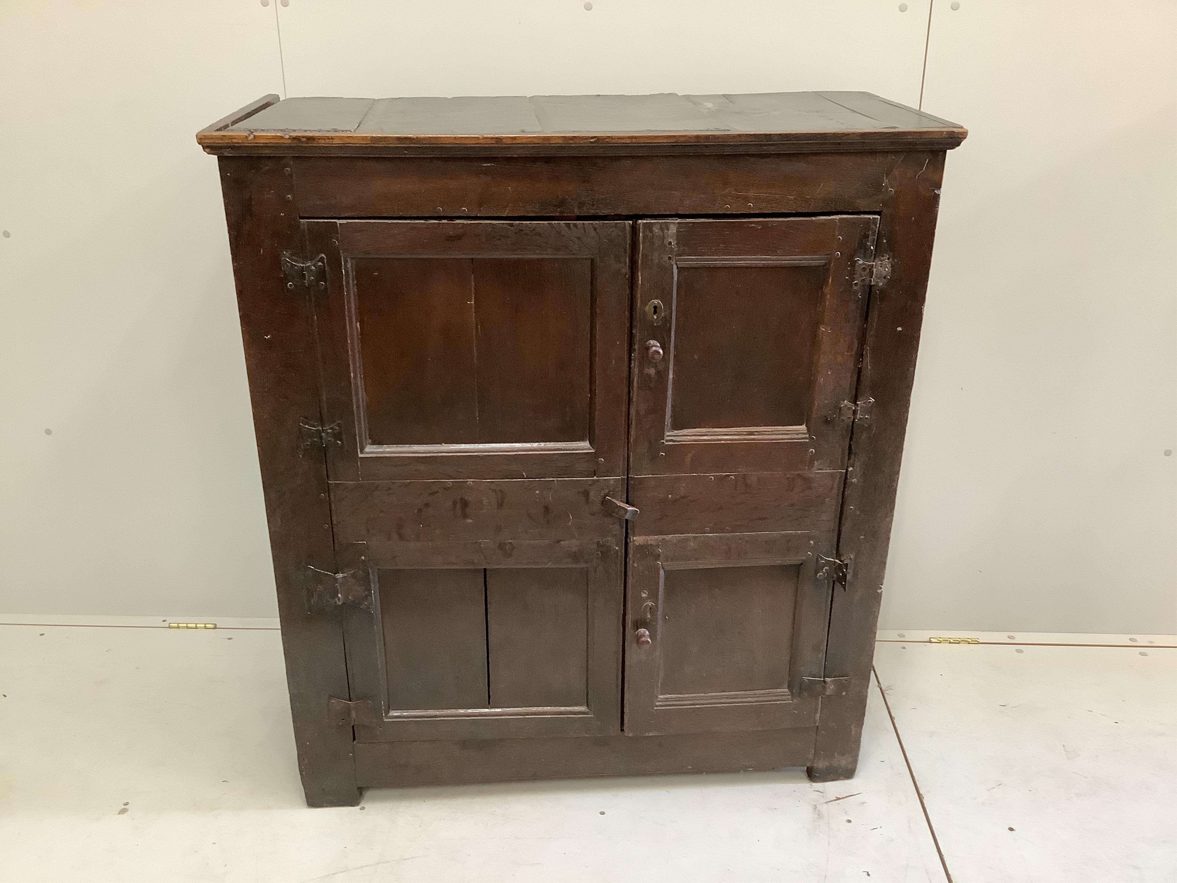 A late 17th century oak two door cupboard, width 106cm, depth 48cm, height 118cm